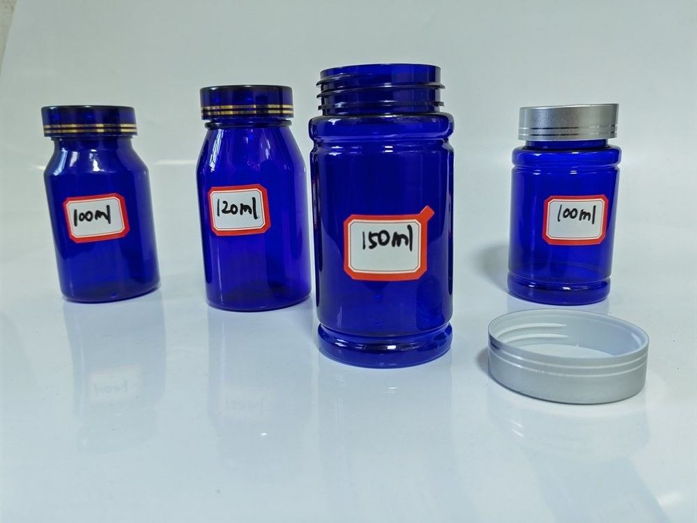 Botella de cápsulas de plástico azul PET de 100 ml con tapa de tornillo de plata Botella de medicamento de suplemento vitamínico