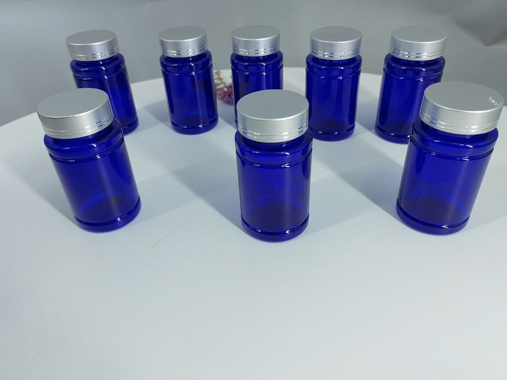 Botella de cápsulas de plástico azul PET de 100 ml con tapa de tornillo de plata Botella de medicamento de suplemento vitamínico